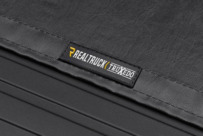 RealTruck TruXedo Sentry Hard Rolling Truck Bed Tonneau Cover | 1585801 | Fits 2019-2026 Dodge Ram 1500 w/Multi-Function (Split) Tailgate 5' 7" Bed (67.4")